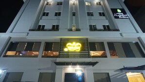 A hotel with a modern facade, multiple floors, and illuminated signage. - Hotel Shree Kanha Residency (Prayagraj)