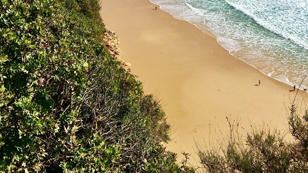 A coastal beach with a clear view of the ocean, a sandy shore, and a cliff with vegetation. - Stunning ocean view, Prime location, Exclusive design (Lagos)