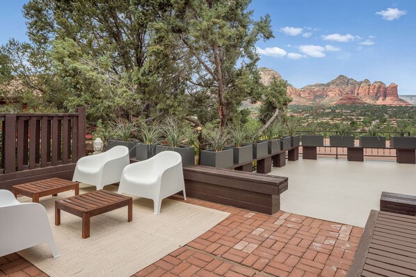 Relax on the patio with a breathtaking view of the surrounding mountains.