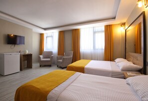 Design-Dreibettzimmer | Italienische Bettbezüge von Frette, hochwertige Bettwaren