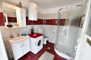 Shower, hair dryer, towels, toilet paper