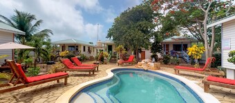 Cabana with WiFi and a shared pool, patio area, and grill - walk to the beach