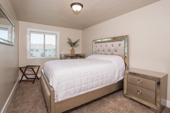 A bedroom with a bed, bedside tables, a window, and a ceiling light. - SLEEPS 18, Best Location,New, Hot Tubs,BBQ, Patio, 5 Mins to Dwntwn, Sauna,Views (Ogden)