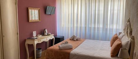 Deluxe Room | Memory foam beds, minibar, in-room safe, desk