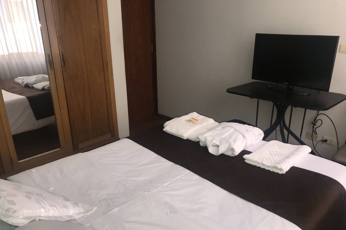 Premium bedding, laptop workspace, soundproofing, iron/ironing board