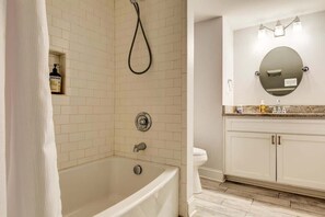 Bathtub, hair dryer, towels