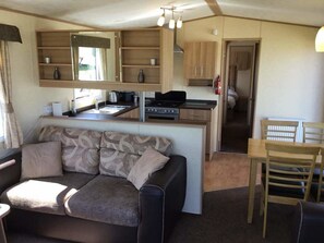 Cabin, Multiple Beds | Living area | 30-inch TV with digital channels