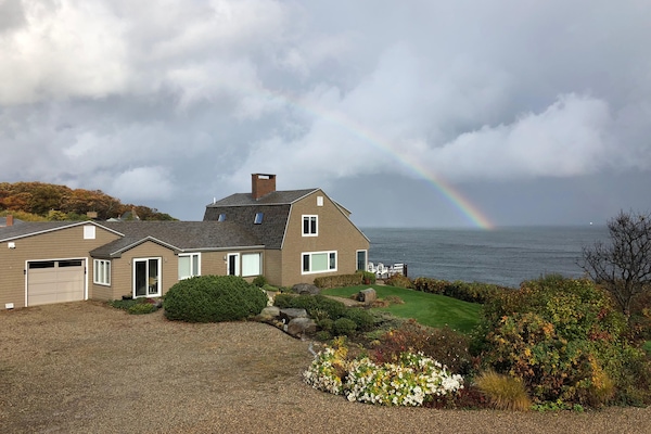 Rainbow over Breakwater House and ocean