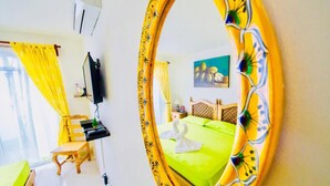 A hotel room with a bed, a television, a small table, and a chair. - Dolce Vita Caribe Superior Double Room with Pool – Self Check-in - Playacar (Playa del Carmen)