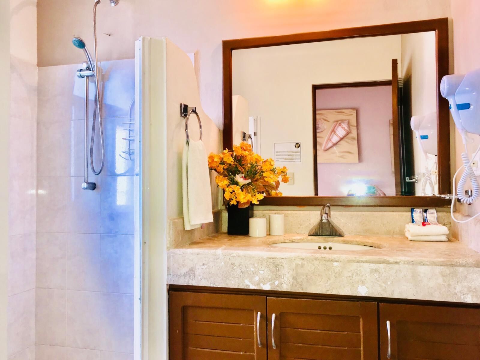 Shower, hair dryer, towels, toilet paper