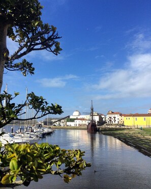 A harbor with boats, a large ship, and buildings in the background. - CAPITAL Suite - START NOW! deluxe suites in historic center (Vila do Conde)