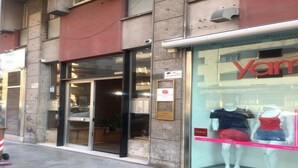 A storefront with a glass front displaying mannequins in casual attire. - The penthouse view with panoramic view (Palermo)
