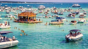 A marina with numerous boats and people engaging in water activities. - HUGE % OFF, Private Pool | 6 Bikes ☀️129 Reviews | Gulf Views | Seagrove 30A ☀️Beach Gear (Santa Rosa Beach)