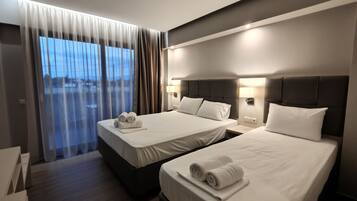 Deluxe Triple Room | Premium bedding, desk, laptop workspace, blackout curtains