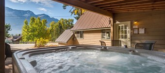 Lake & forest-view chalet with private hot tub - dog-friendly