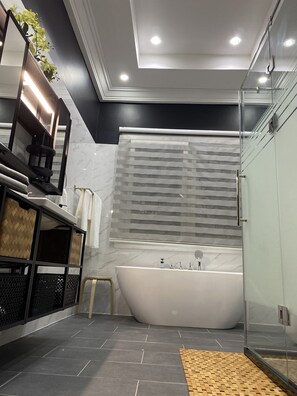 Bathtub, hair dryer, towels, soap