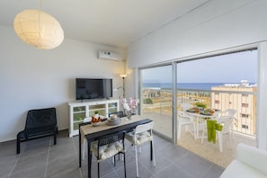 Apartment, 2 Bedrooms, Sea View | Living area | Flat-screen TV