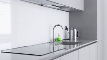 Fridge, stovetop, dishwasher, coffee/tea maker