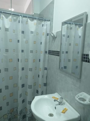 Shower, towels, soap, toilet paper