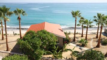 On the beach, sun loungers, beach towels