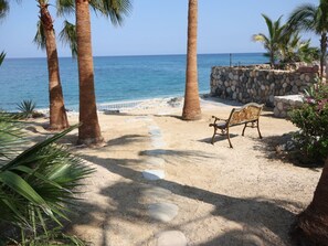On the beach, sun-loungers, beach towels