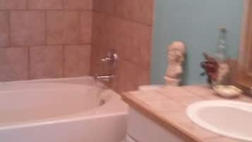 Combined shower/tub, hair dryer, towels, soap