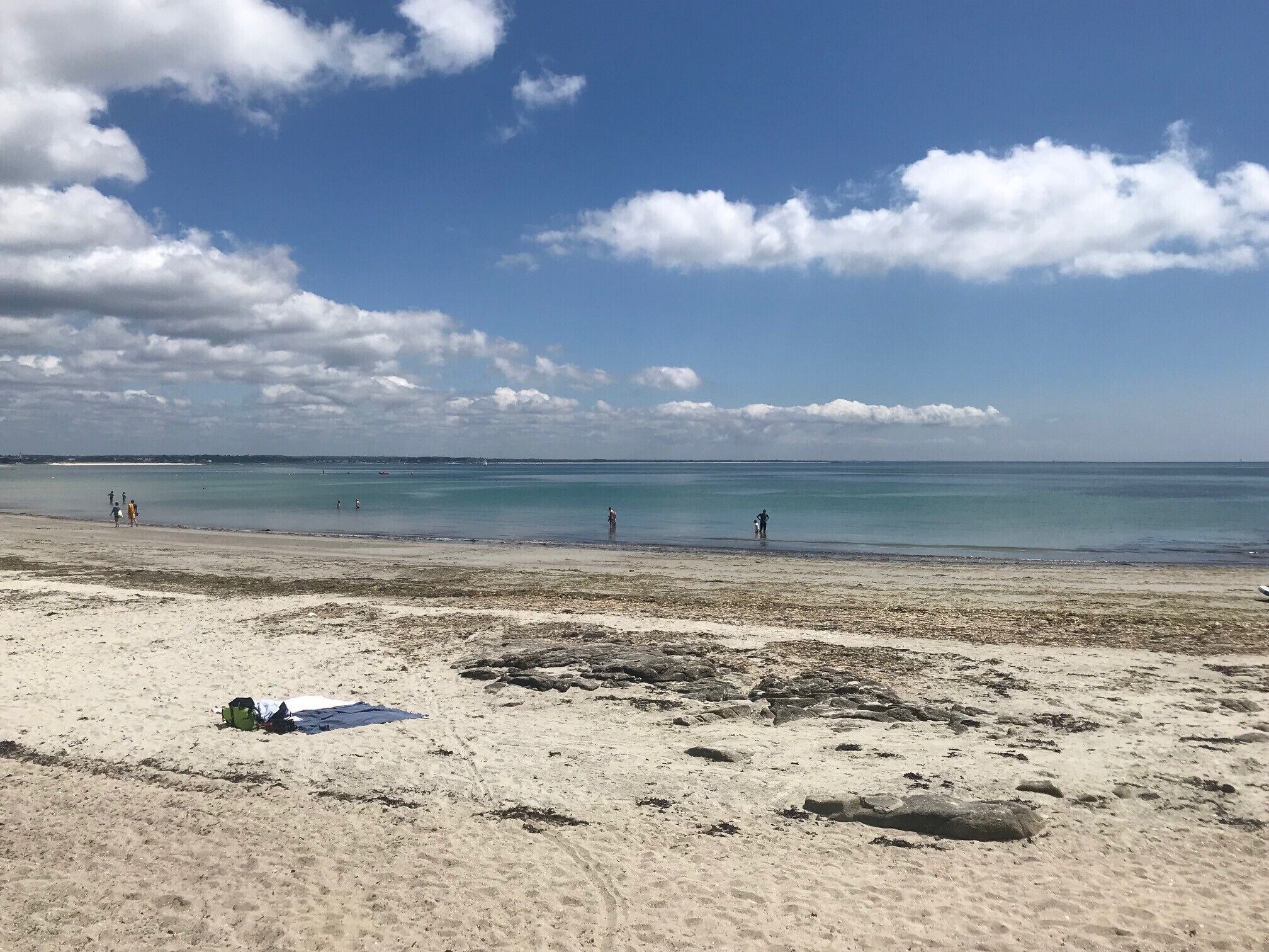 A beach with clear skies and calm waters.