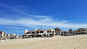 On the beach, sun-loungers, beach towels
