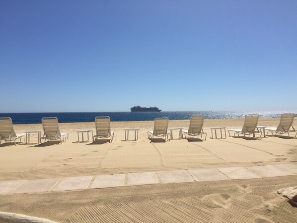 On the beach, sun loungers, beach towels