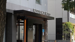 A modern building with a sign reading "RESIDENCE HOTEL." - Grand Residence Hakataeki Minami (Fukuoka)