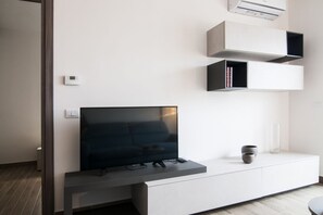 Living area - GuestHost - Comfortable apartment located on the seventh floor of a modern residence equipped with a lift.In 40 square meters of space it comfortably accommodates 2 people with a double bedroom.Located in the Fonte Laurentina district, near the ring road (Roma)