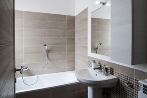 Bathtub, hair dryer, bidet