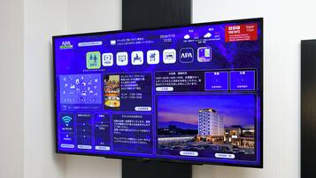 A digital display of a hotel with a view of a cityscape at night.