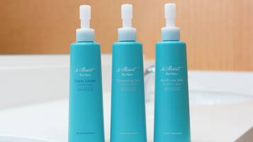 Three bottles of Ryusu Spa products on a white surface.