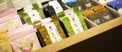 A variety of packaged goods in a wooden display case.