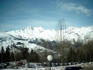 Surrounded by snow-covered peaks, this serene landscape offers breathtaking views.