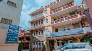 A multi-story hotel with balconies and signage indicating it is a holiday inn. - Hotel River Holiday Inn (Kathmandu)
