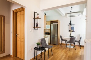 Apartment, 1 Bedroom | Living area | 43-inch flat-screen TV with satellite channels, Smart TV, Netflix - UPSTREET Delightful 1BD Apt in Plaka (Athens)