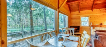 Dog-friendly cottage on the river with private hot tub, mountain views & firepit