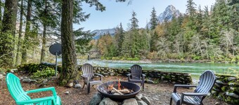Dog-friendly cottage on the river with private hot tub, mountain views & firepit