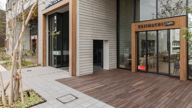 A modern hotel entrance with a wooden facade and large glass windows. - JR East Hotel Mets Premier Tokyo Bay Shinkiba (Tokyo)