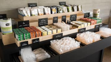 A display of various tea and hair care products with labels in multiple languages.