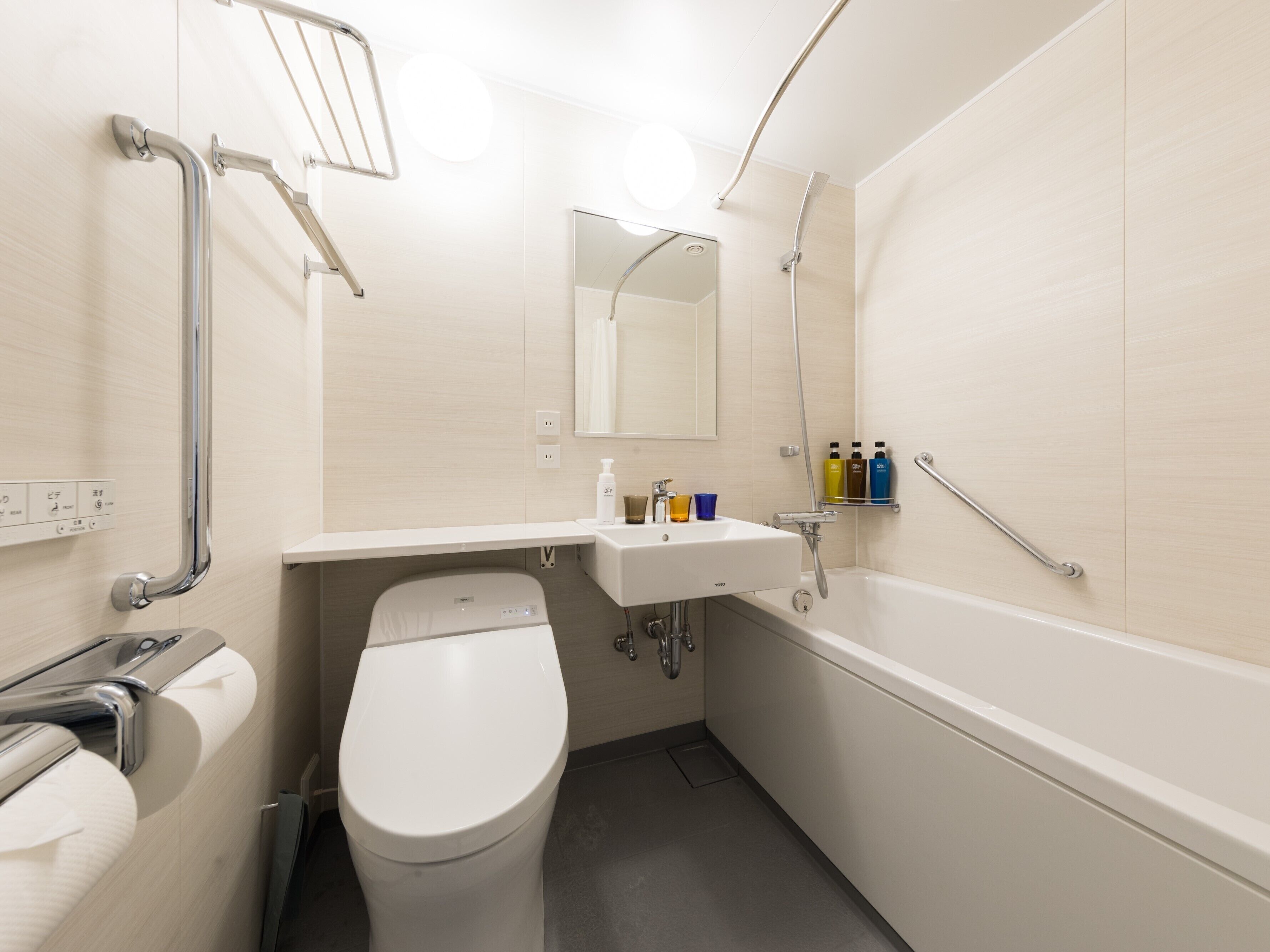 hair dryer, slippers, electronic bidet, towels