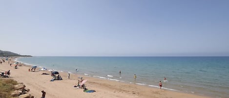 On the beach, sun loungers