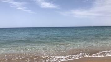 On the beach, sun-loungers