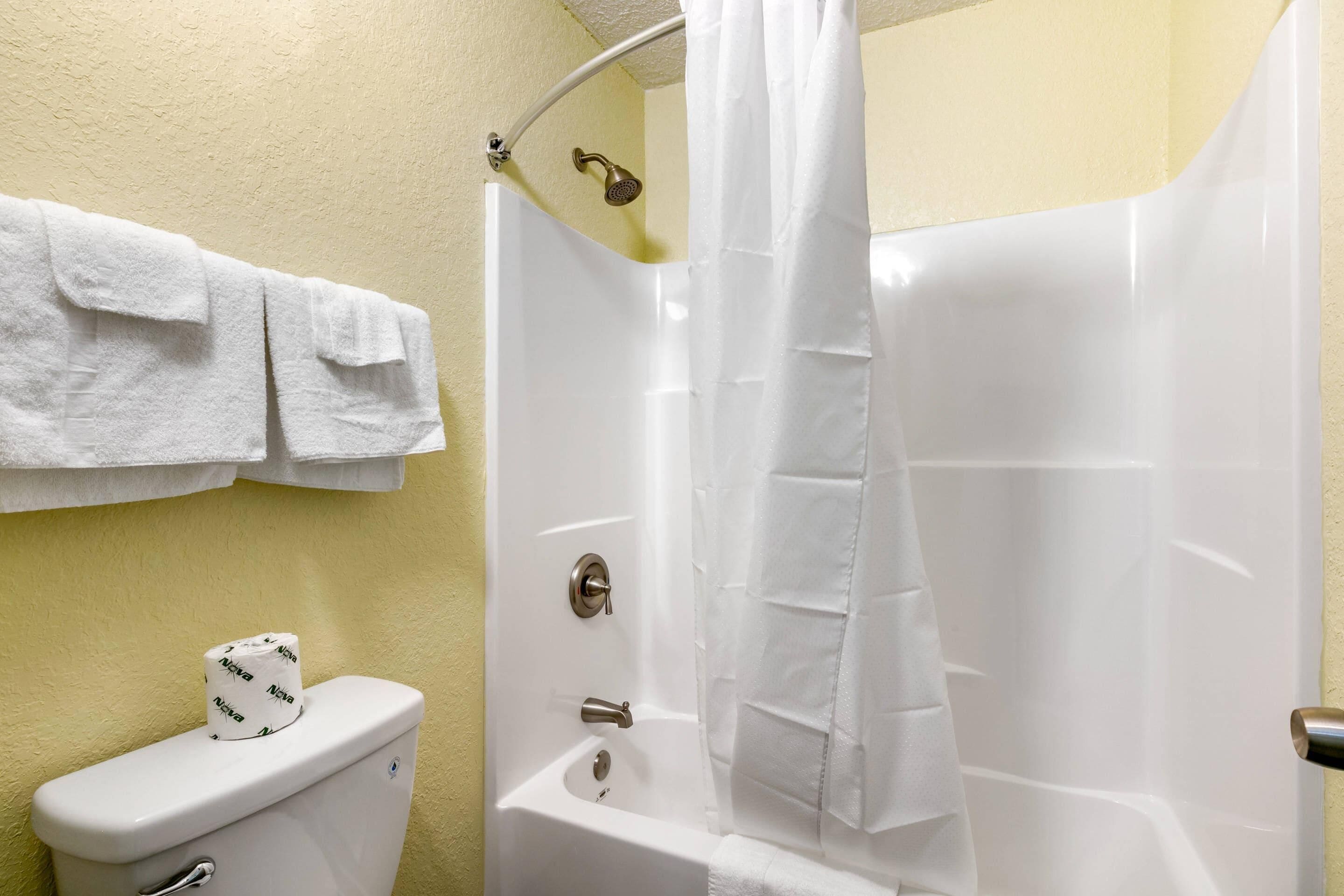 Standard Room, 1 King Bed, Non Smoking | Iron/ironing board, WiFi (free), bed sheets