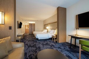 Desk, blackout drapes, iron/ironing board, bed sheets