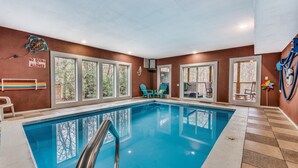 An indoor swimming pool with clear glass walls, a 'No Diving Allowed' sign, and a 'No Diving Allowed' sign on the wall. - Heated Pool, Movie Room, Sleeps 30, Dogs Welcome (Cosby)