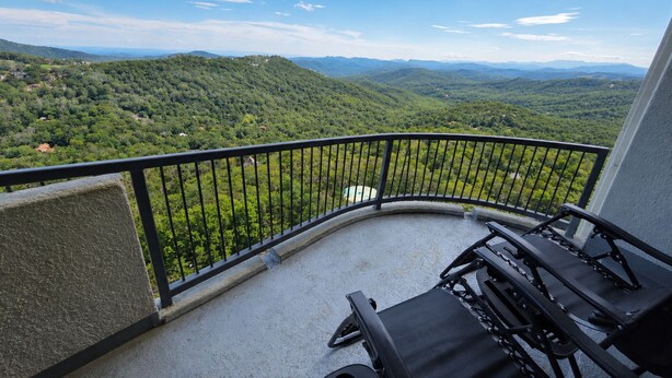 A balcony with a view of a mountainous landscape. - Sugartop Resort 6th-Floor Corner Condo: Breathtaking Mountain Views - 2BR (Sugar Mountain)
