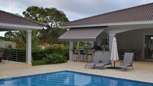 A swimming pool with lounge chairs and a covered patio area. - THIS IS IT!!!!!! Newly built Renters Paradise (Sosua)